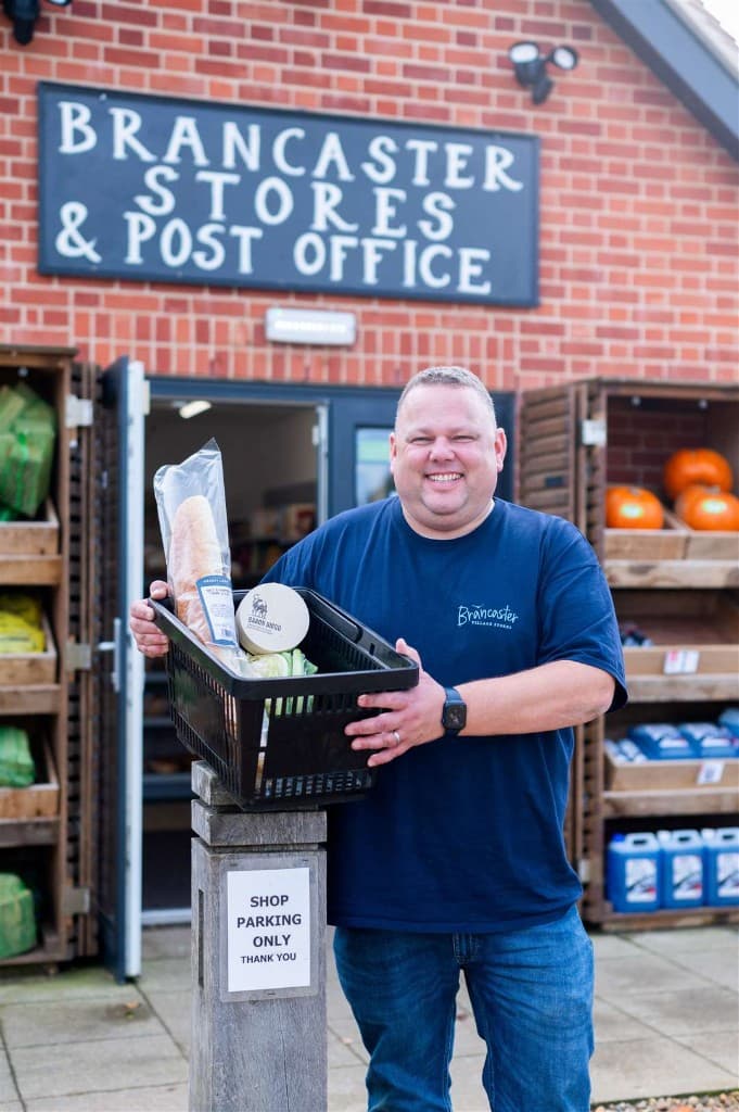 Mark outside Brancaster Stores and Post Office